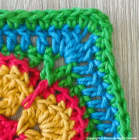Round 8 of African flower crochet square expanding the square shape