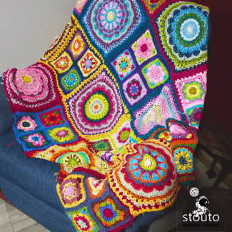 Detailed texture of flower crochet motifs in mixed yarn colours