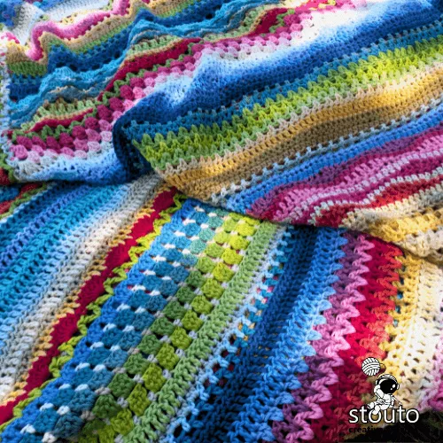Mixed crochet stitches sampler afghan with colorful stripe design