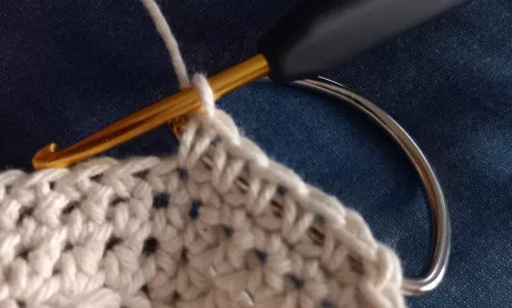 5 crochet stitches over metal ring for cotton tote bag