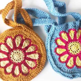 Round crochet flower bag with large crochet flower in center