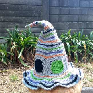 Halloween crochet witch hat with round polka Dots and stripes