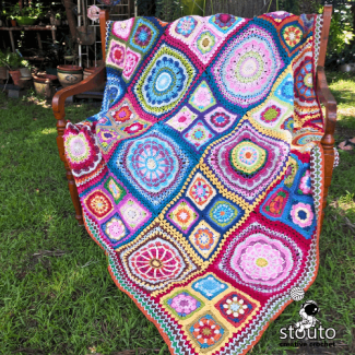 African flowers patchwork afghan with bright colorful crochet squares