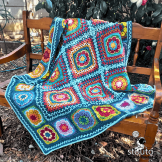 Find Peace crochet lapghan made with African flower granny squares