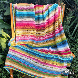 Multi stitch crochet blanket pattern with alternating stitch rows