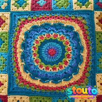 Flower and Squares crochet pillow pattern with colourful floral centre and granny squares
