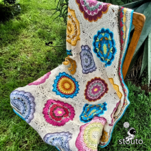 African Flowers granny squares bouquet blanket with vibrant floral design