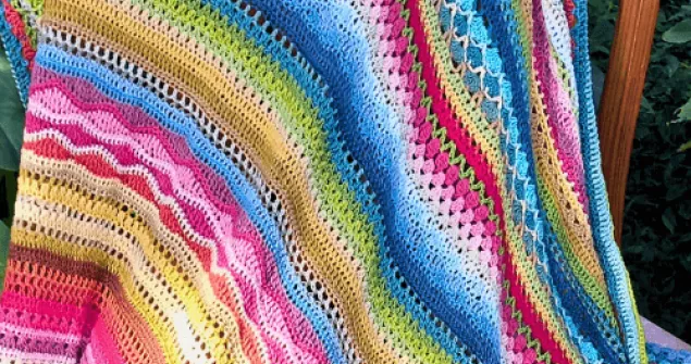 Crochet sampler blanket showcasing different stitch textures